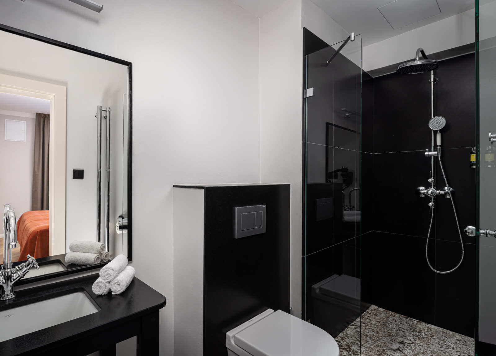 Black marble bathroom with rain shower