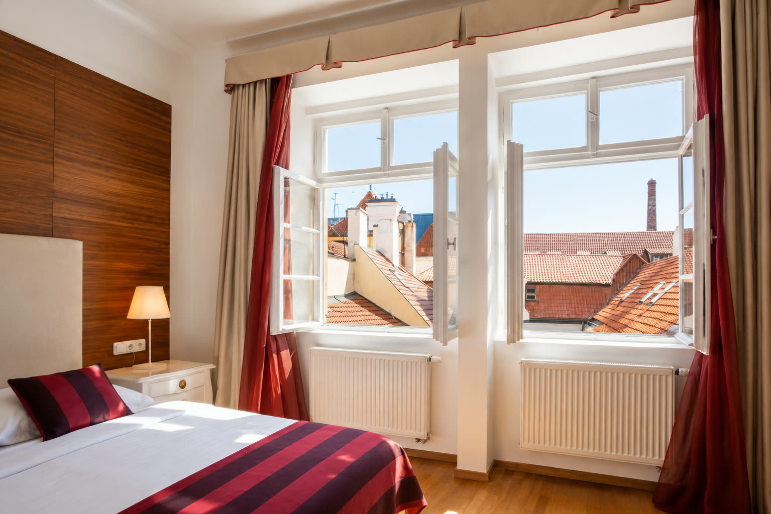 Double room with open windows over Old Town rooftops